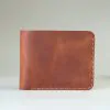 Slim leather bifold with hand-stitching open slots
