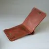 Slim leather bifold with hand-stitching open slots